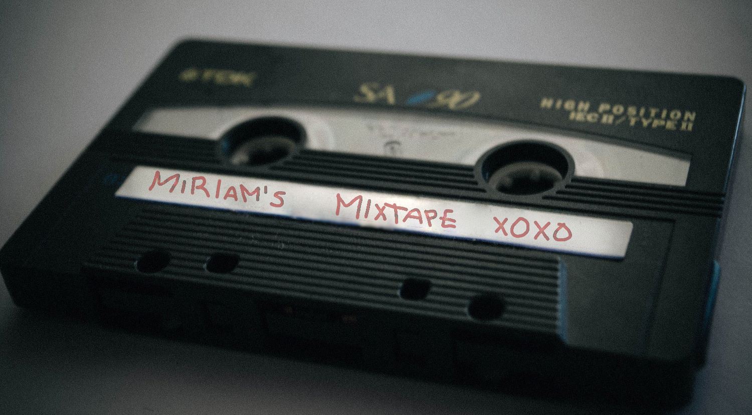 Cassette tape that says "Miriam's Mixtape XOXO."