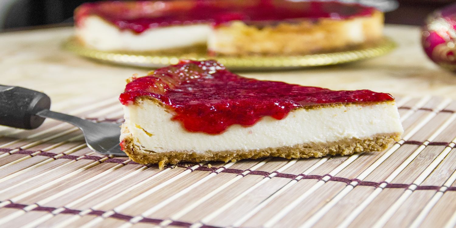 Slice of cheesecake with strawberry glaze/